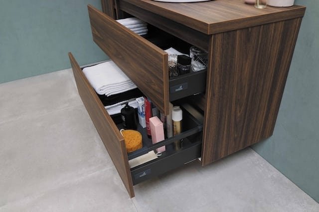 brown chest of drawers with open drawers
