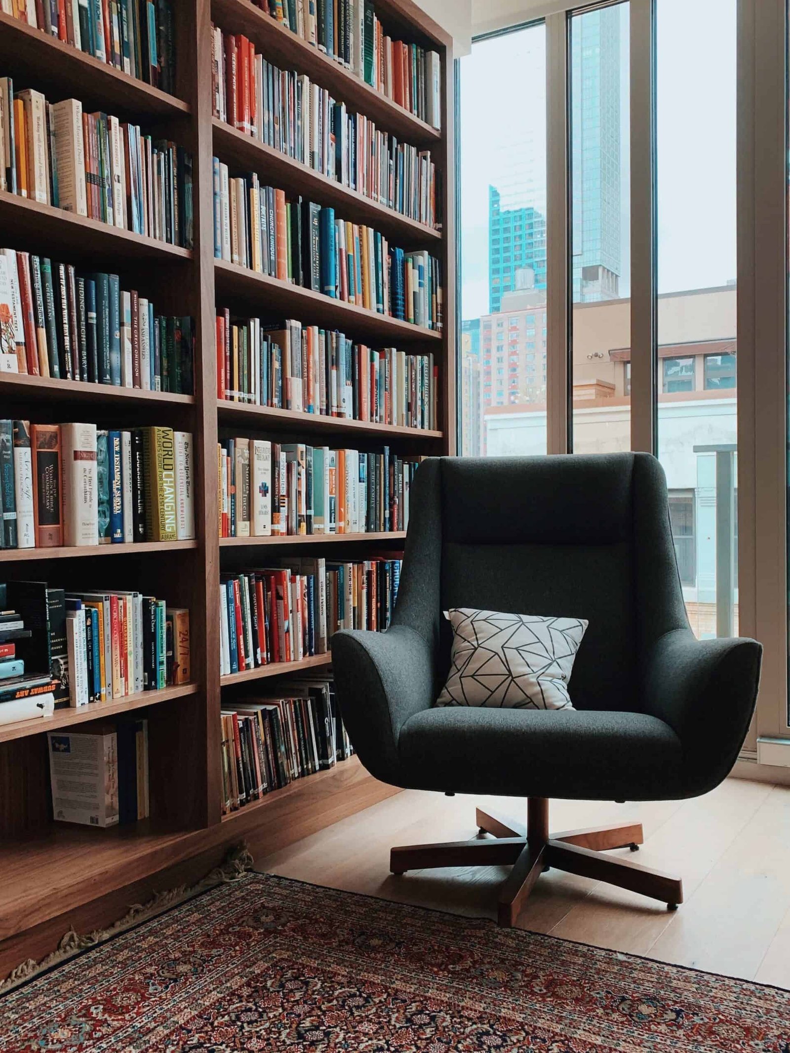 bookshelf and armchair in a study room