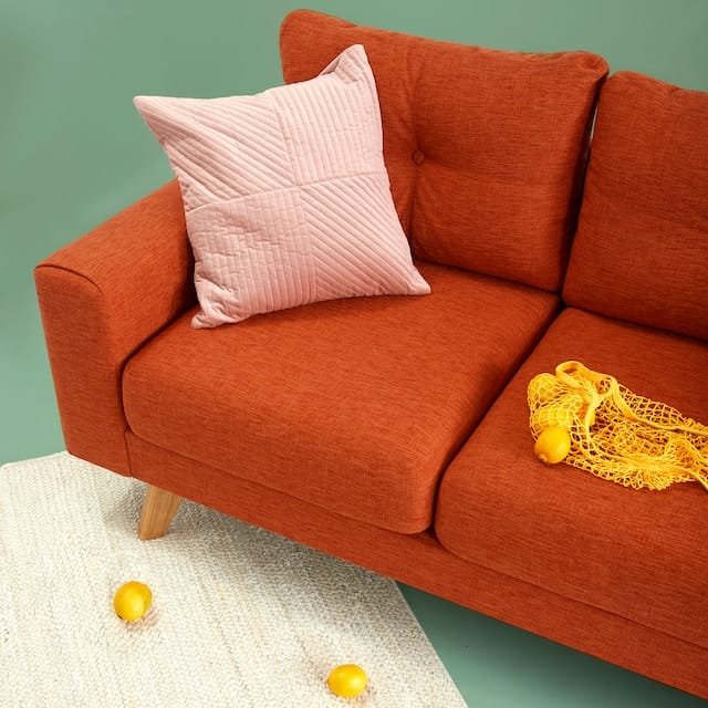 pink pillow on sofa